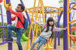© weedezign - Two kids boy and girl having fun to play on children's climbing toy at school playground,back to school activity.kindergarten preschool.