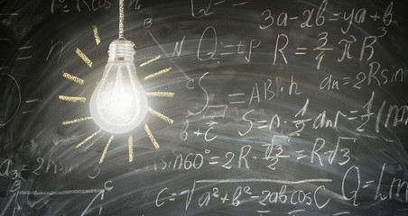 idea concept with bright glowing light bulb on blackboard with math formulas in background banner