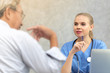 © thbangkok - Female doctor giving a consultation to her male patient and explaining medical informations and diagnosis at the clinic or hospital.
