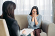 © Nomad_Soul - Female patient sitting on sofa at psychotherapist