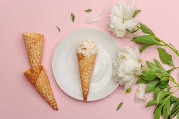 Wall Mural - Delicate cream ice cream on a white plate. Flatlay on a pink background with white peonies. Top view. Copy space