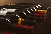 Bottles With Delicious Wine On Shelf, Closeup. Professional Sommelier