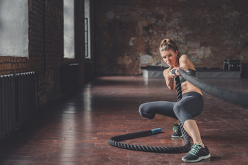 Young athletic girl with a rope