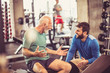 © Mladen - Cheerfully talk at gym.