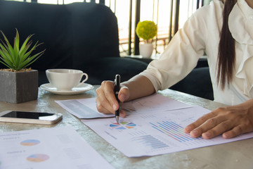 Businesswoman hands analyzing financial statistics. Analysis of financial reports.