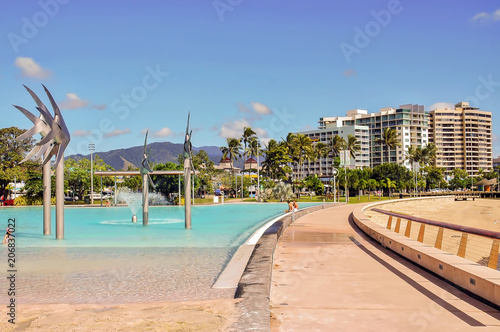 Fotomural View of public pool and coastal buildings in Cairns, Australia.