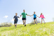 © Louis-Paul Photo - Parents with children sport running together outside