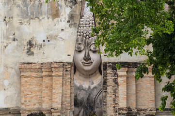 Wall Mural - Old buddha statue inside the hall at Wat Sri Chum in Sukhothai, Thailand.