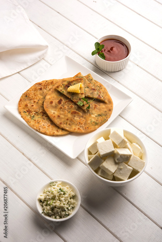 Stuffed Paneer Paratha With Melting Butter Served With Fresh