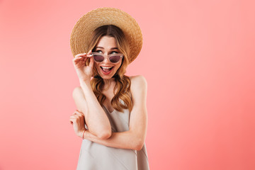 Wall Mural - Mystery happy brunette woman wearing in dress, hat and sunglasses