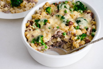 Casserole with pasta, chicken, broccoli and Bechamel sauce under a cheese crust