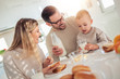 © ivanko80 - Happy young family having breakfast