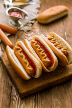 Three Classic Hot Dogs With Ketchup And Mustard