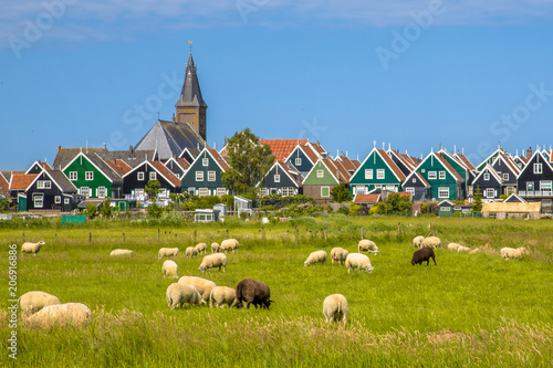 Cuadros en Lienzo Dutch Village with colorful wooden houses and church