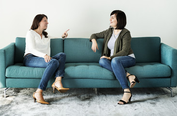 women talking together on the couch