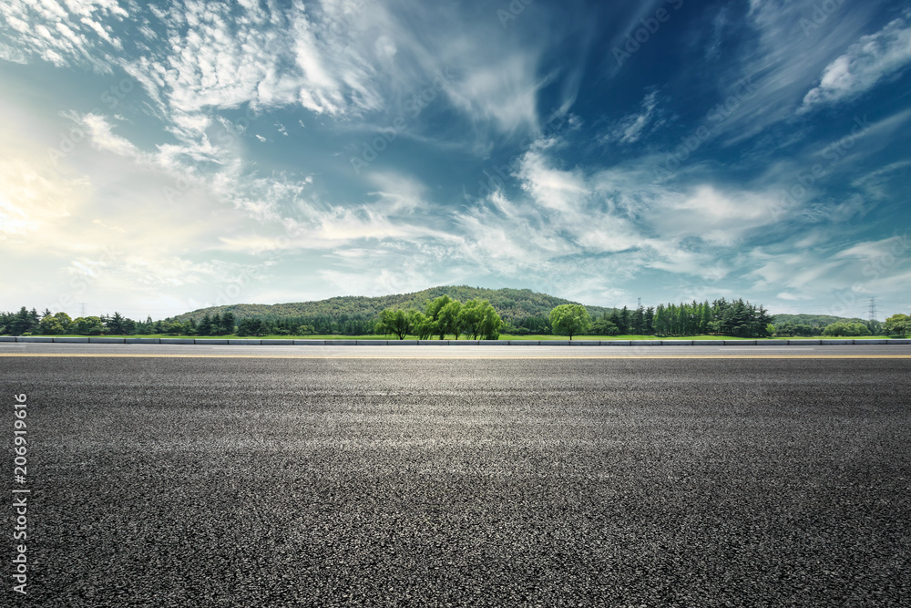 Asphalt road and mountain with sky clouds landscape at sunset - obrazy, fototapety, plakaty 