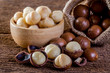 Macadamia nut on wooden table.