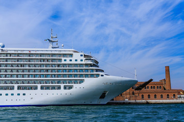 Wall Mural - Luxury Cruise Ship Docked by Old Brick Building