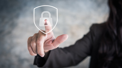 Leinwandbilder - Person touching virtual button a shield with a lock symbol, concept about security, cybersecurity and protection against dangers