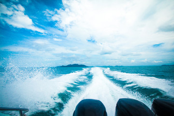 Splashing sea from back boat