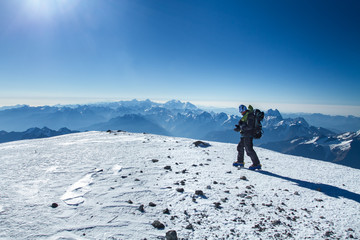 Wall Mural - A man stands on top of Mount Elbrus