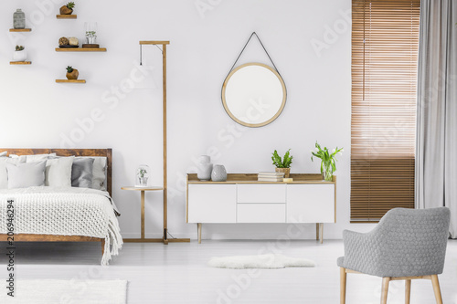 Scandinavian Style White Room Interior With Round Mirror On The