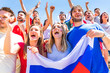 © william87 - Russian supporters celebrating at stadium with flags