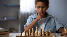 Little Boy Thinking On Chess Move, Intelligent Hobby, Logic Development, Leisure