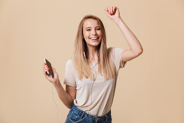 Sticker - Portrait of a happy casual girl in earphones