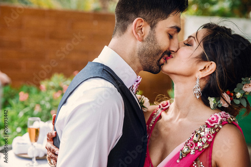 Indian Bride And Groom Kiss Each Other Tender After The Wedding
