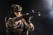 © fotofabrika - Special forces soldier with rifle on dark background