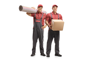 Wall Mural - Two movers holding a carpet and a package