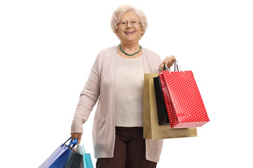 Wall Mural - Mature woman with shopping bags