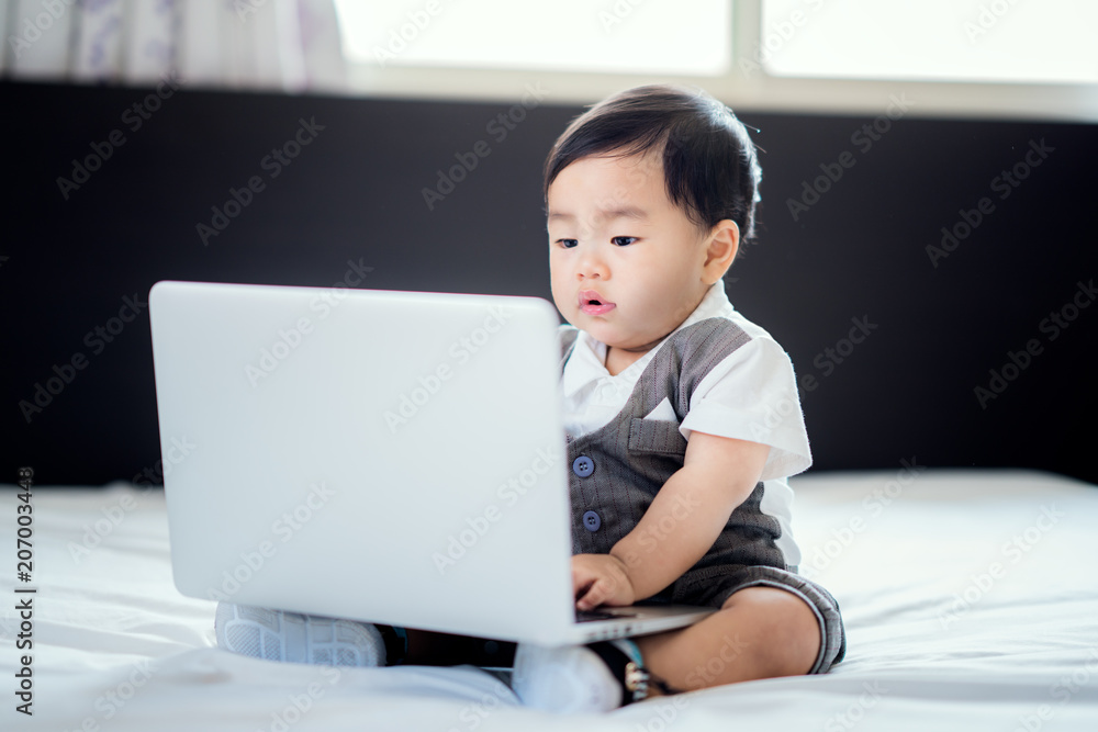 Asian baby sit in working action with business uniform and note book ...