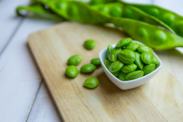 Sticker - Petai, Bitter Beans on wood table, Thai vegetable food, Parkia speciosa seeds