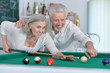 © aletia2011 - senior couple playing billiard