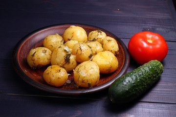 Poster - Cooked potatoes on a plate, cucumber, tomatoes