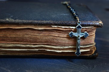 Wall Mural - Rosary and the Bible on a dark background