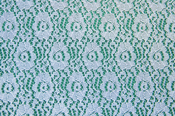  Openwork lace pattern on a green background