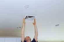 Ceiling Mounted Air Conditioner. New White Air Conditioning Vent Closeup