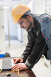 © guruXOX - Maintenance engineer inspect relay protection system with laptop computer
