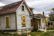 © Tom - Abandoned Home In Disrepair With Boarded Up Windows