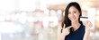 © Atstock Productions - Young smiling beautiful Asian woman presenting credit card in hand