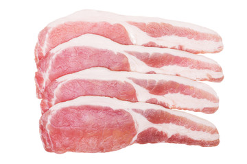 four raw bacon slices isolated on white. from above.