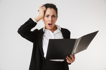 Poster - Nervous confused young business woman holding folder