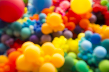 Wall Mural - bright abstract background of jumble of rainbow colored balloons celebrating gay pride