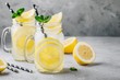 canvas print picture - Homemade refreshing summer lemonade drink with lemon slices and ice in mason jars