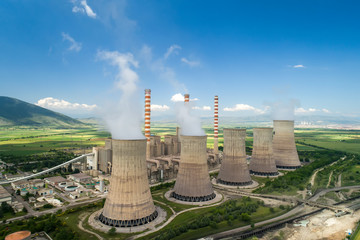 aerial view the plant producing electrical energy with large pipes at kozani in northern greece.