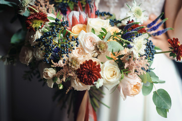 Stunning bridal bouquet. Wedding ceremony. Mix of peony, succulents, orchids and roses. Modern bridal accessories. Wedding flowers