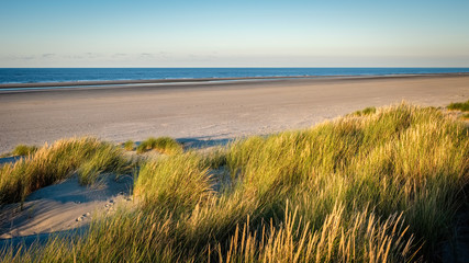 The colortones are becoming warmer when the evening has arrived on the shore of the Wadden Island of Schiermonnikoog (Friesland, the Netherlands) on a sunny late September afternoon.